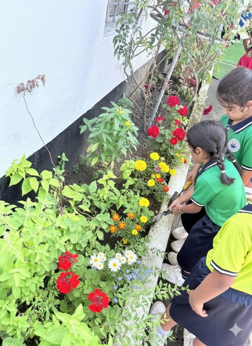 Students planting flowers in the school garden